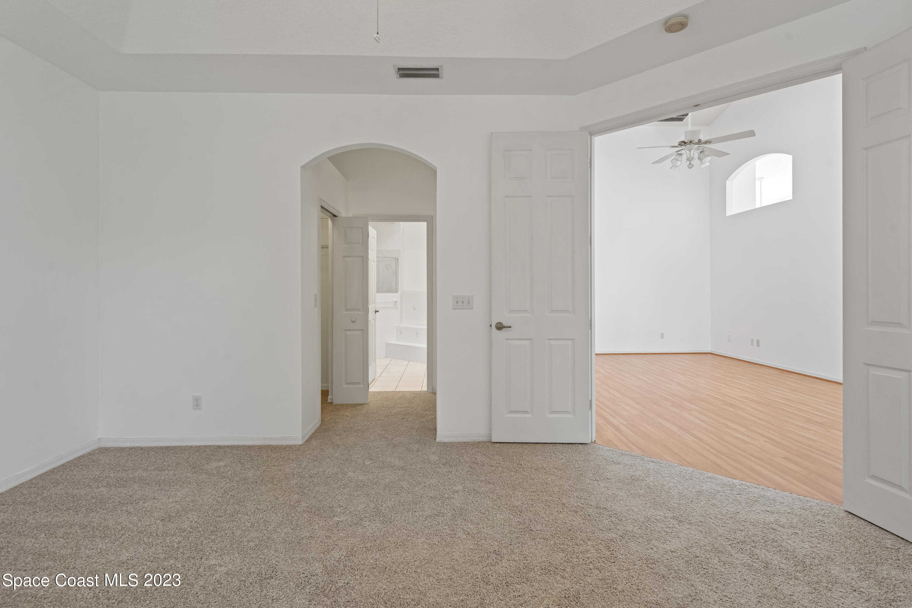 448 Renaissance Avenue Melbourne, FL 32940 - Photo 25 of 57 an empty room with closet and wooden door