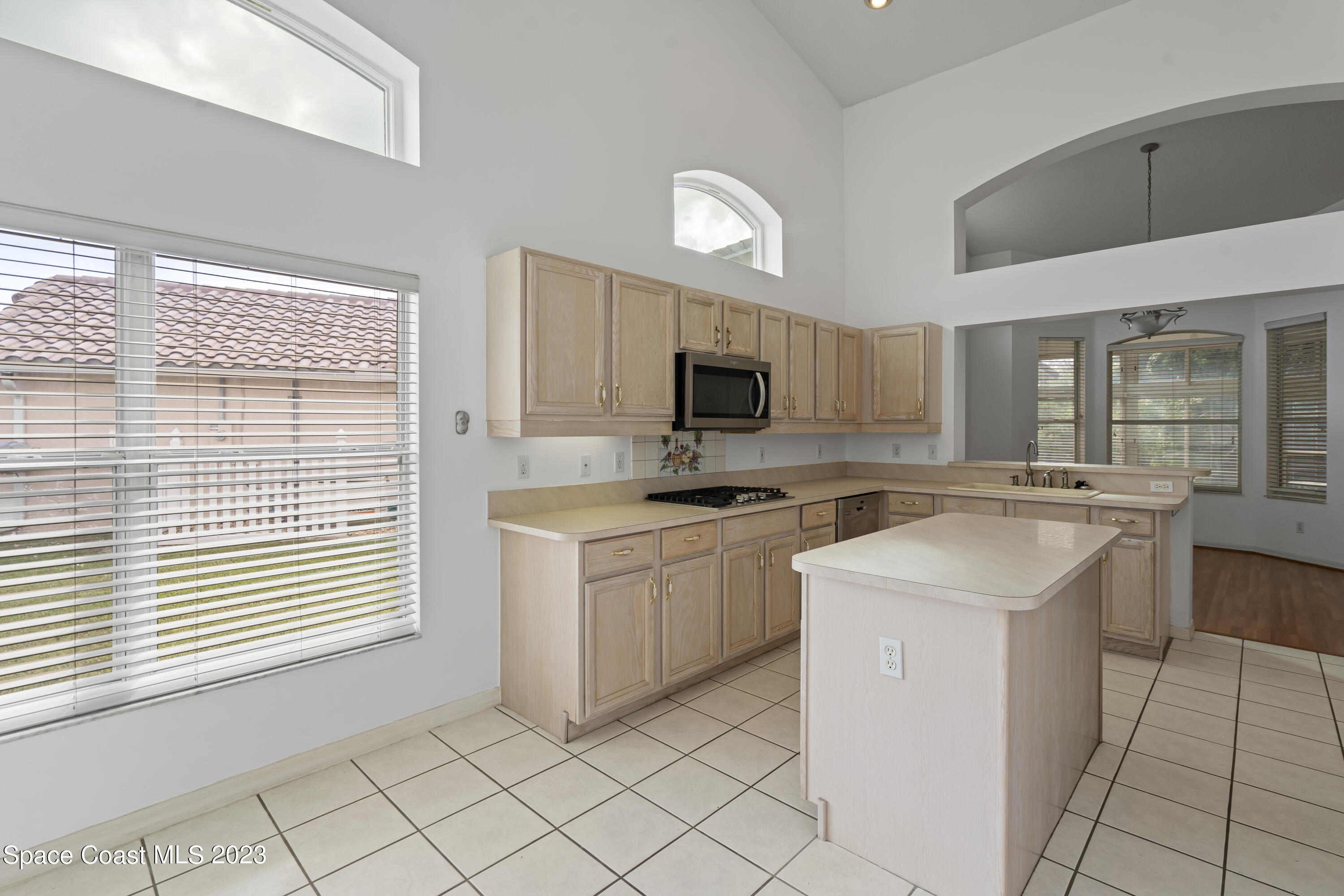 448 Renaissance Avenue Melbourne, FL 32940 - Photo 37 of 57 a kitchen with a sink cabinets and window