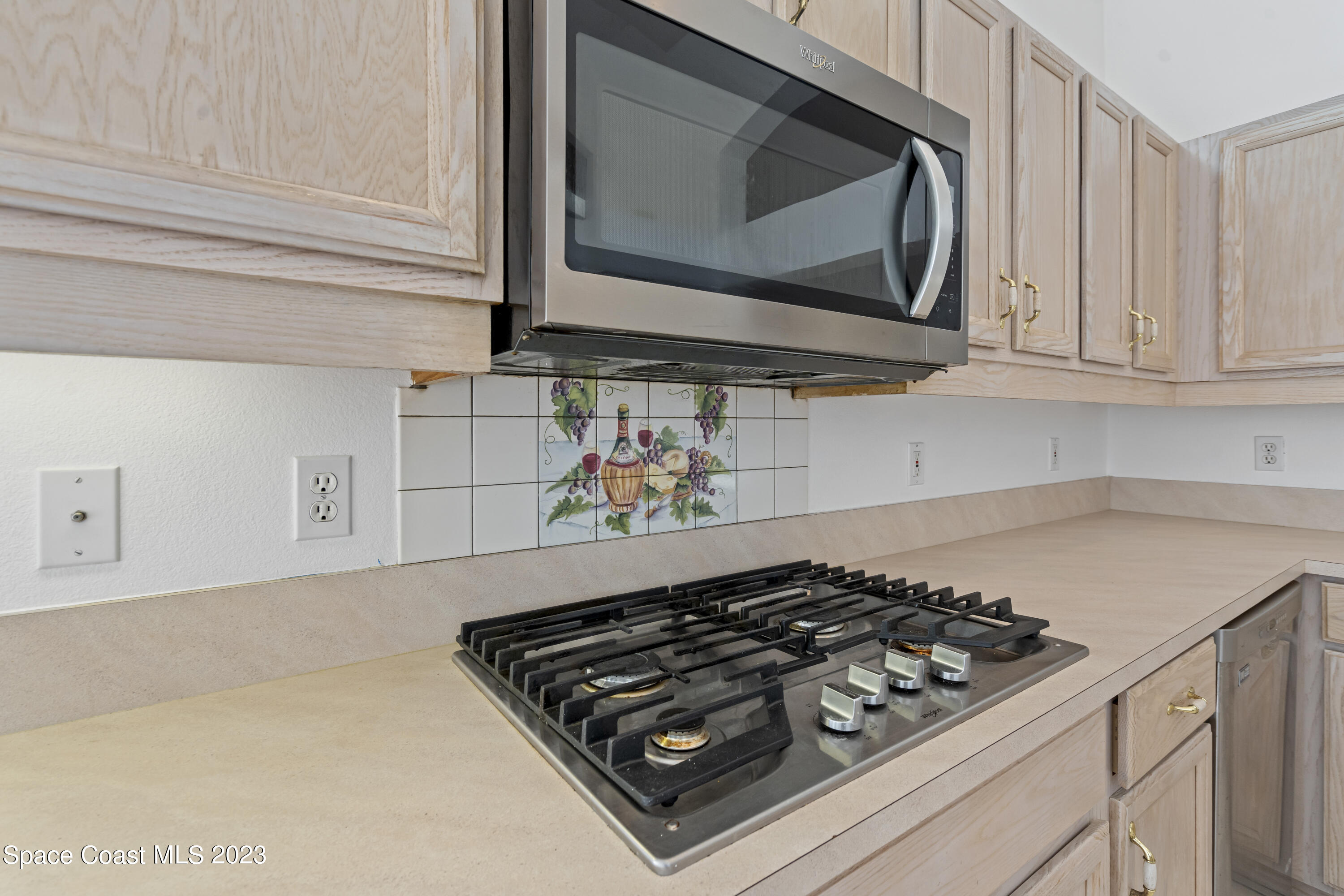 448 Renaissance Avenue Melbourne, FL 32940 - Photo 38 of 57 a stove top oven sitting inside of a kitchen