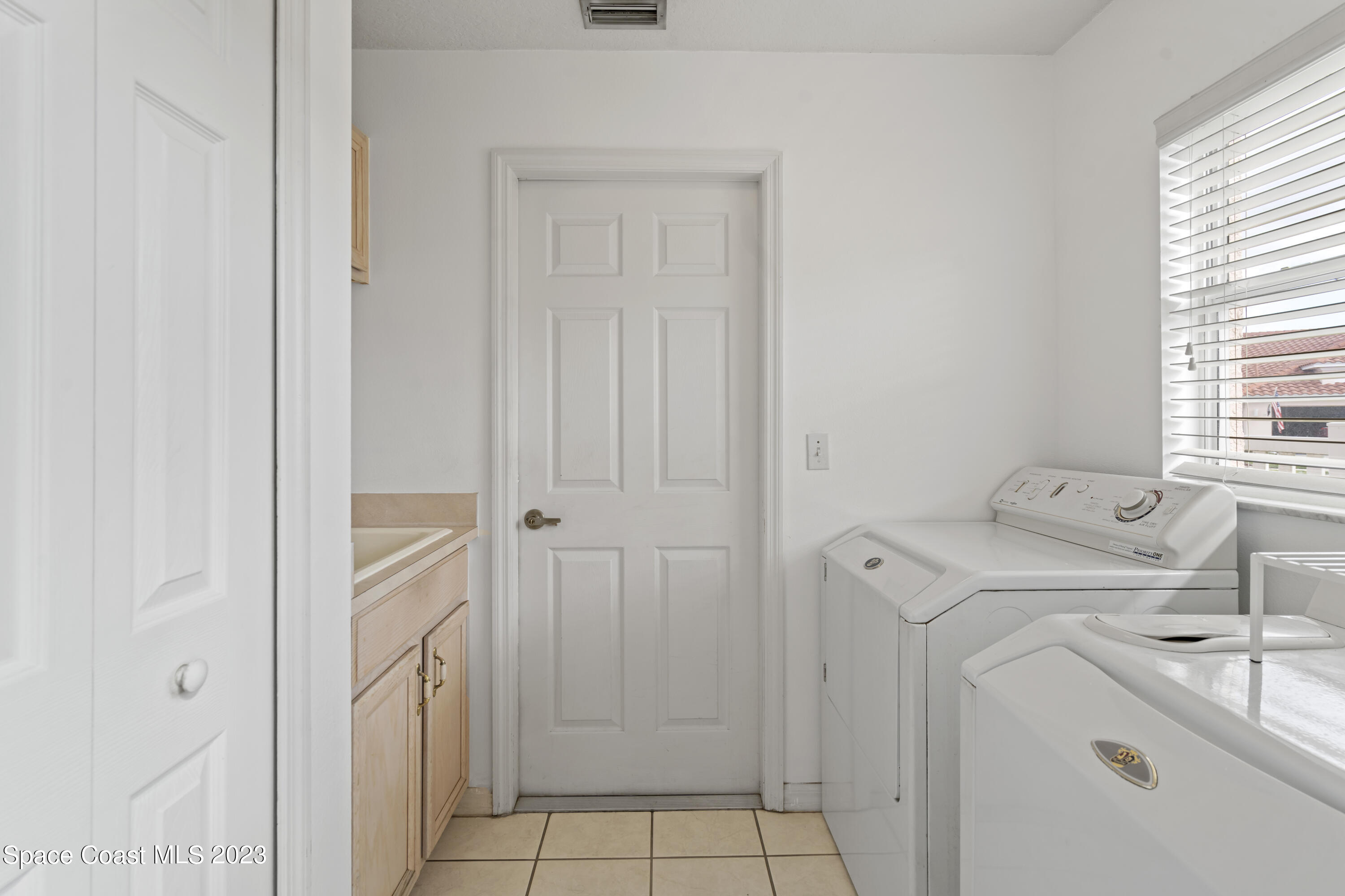 448 Renaissance Avenue Melbourne, FL 32940 - Photo 39 of 57 a view of a storage & utility room with a window