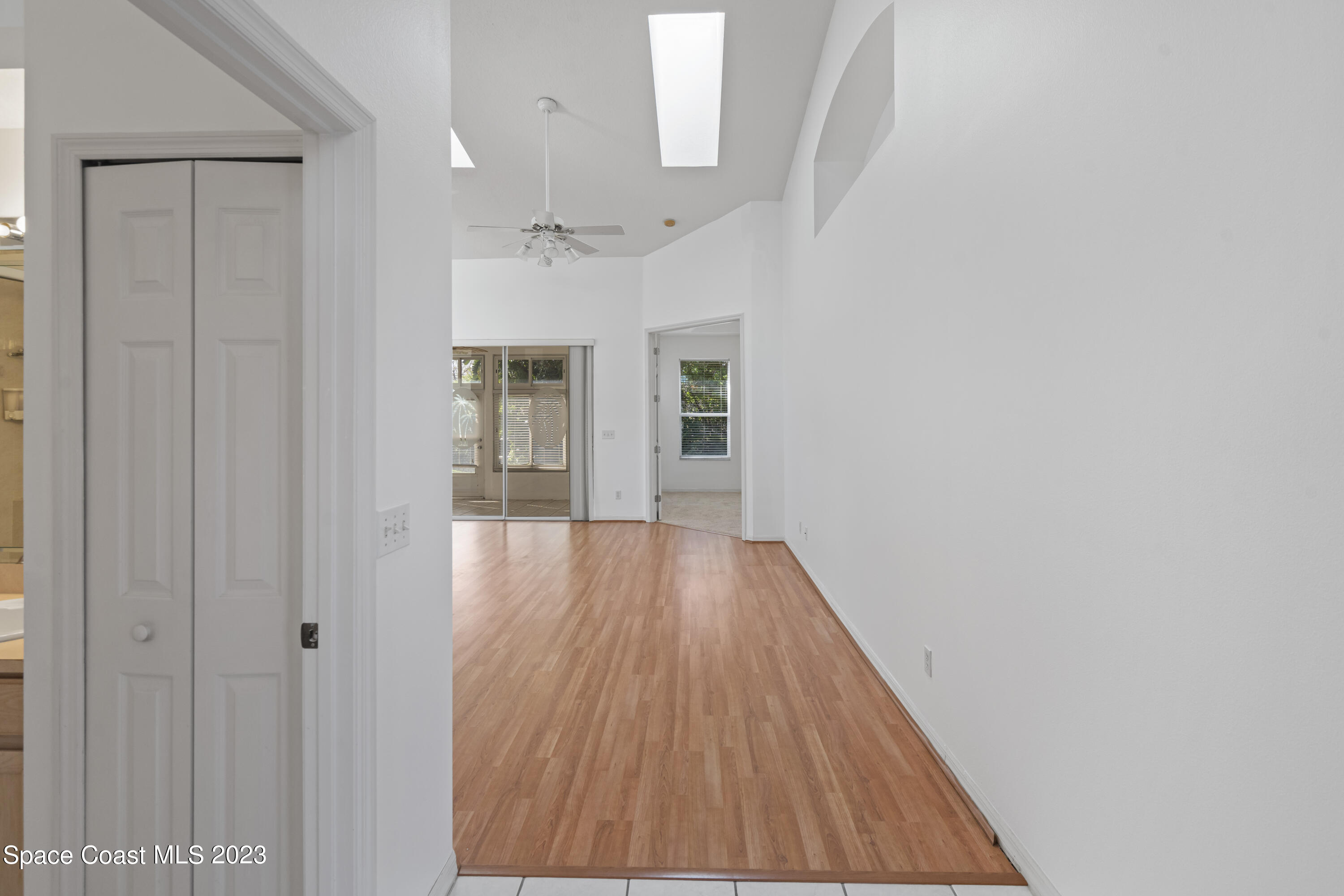 448 Renaissance Avenue Melbourne, FL 32940 - Photo 4 of 57 a view of a hallway with wooden floor and a large window