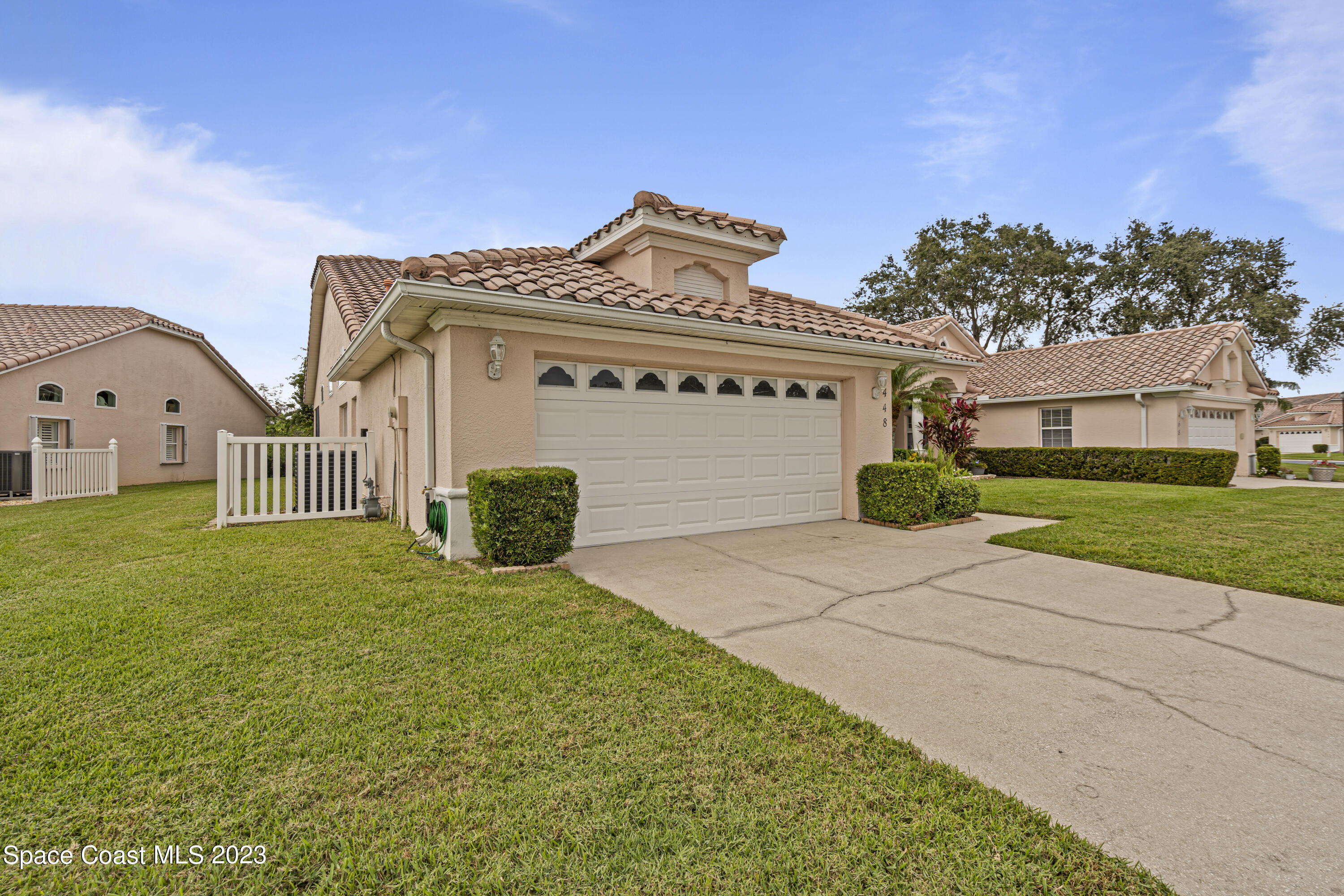 448 Renaissance Avenue Melbourne, FL 32940 - Photo 49 of 57 a view of a house with a small yard and plants