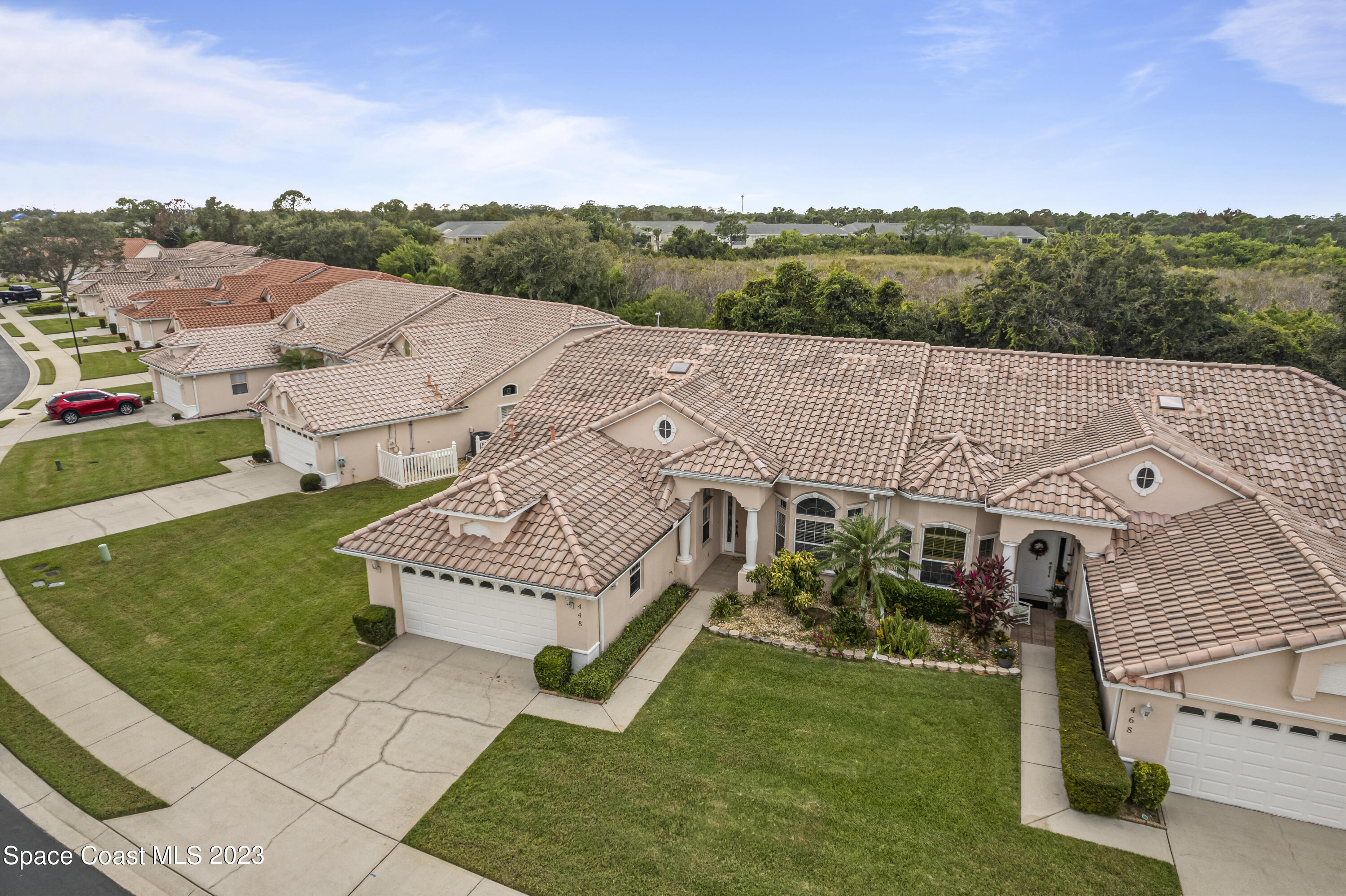 448 Renaissance Avenue Melbourne, FL 32940 - Photo 50 of 57 a view of a house with a yard