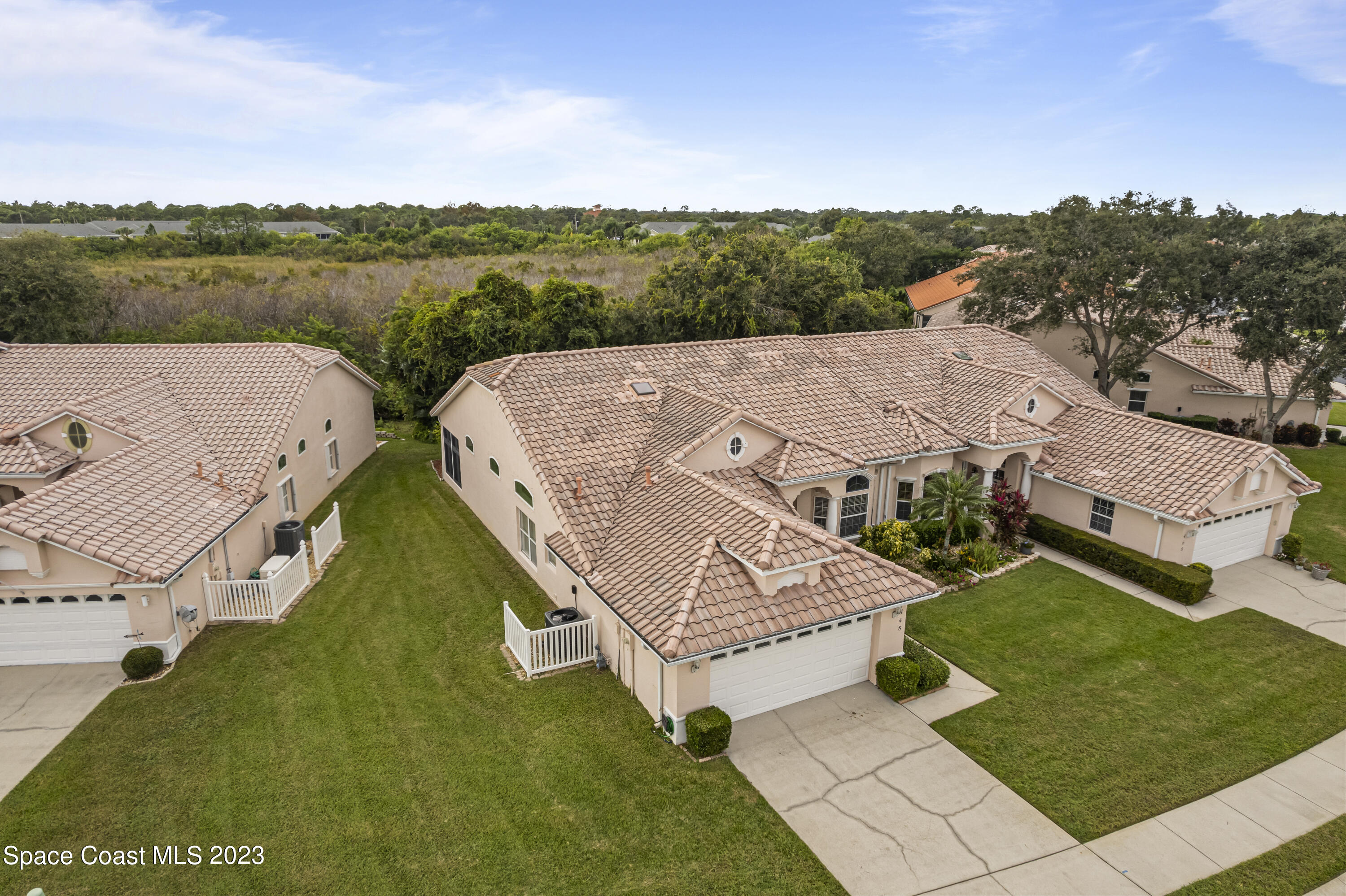 448 Renaissance Avenue Melbourne, FL 32940 - Photo 51 of 57 an aerial view of residential houses with outdoor space and city view