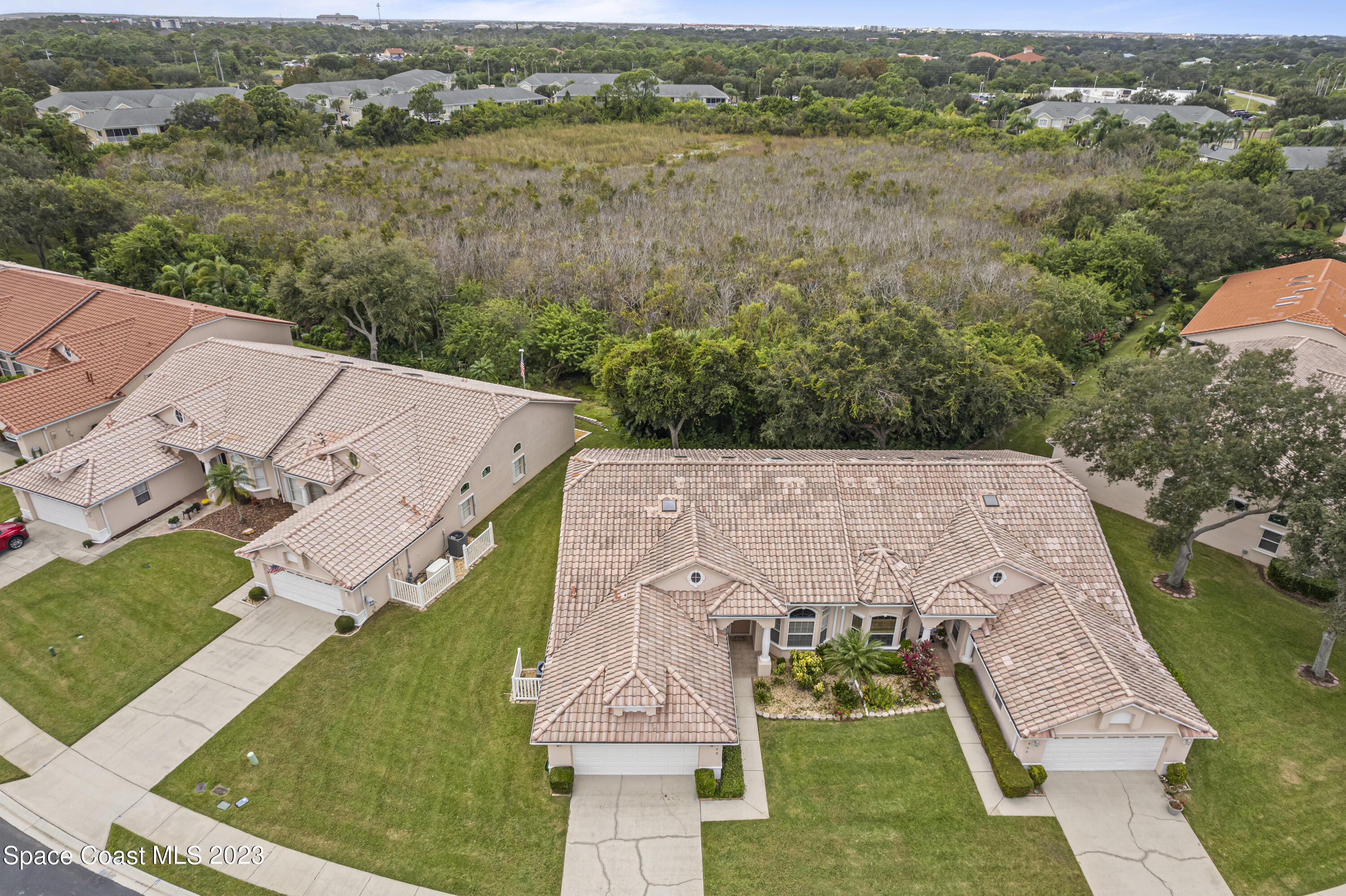 448 Renaissance Avenue Melbourne, FL 32940 - Photo 56 of 57 an aerial view of a house with a lake view