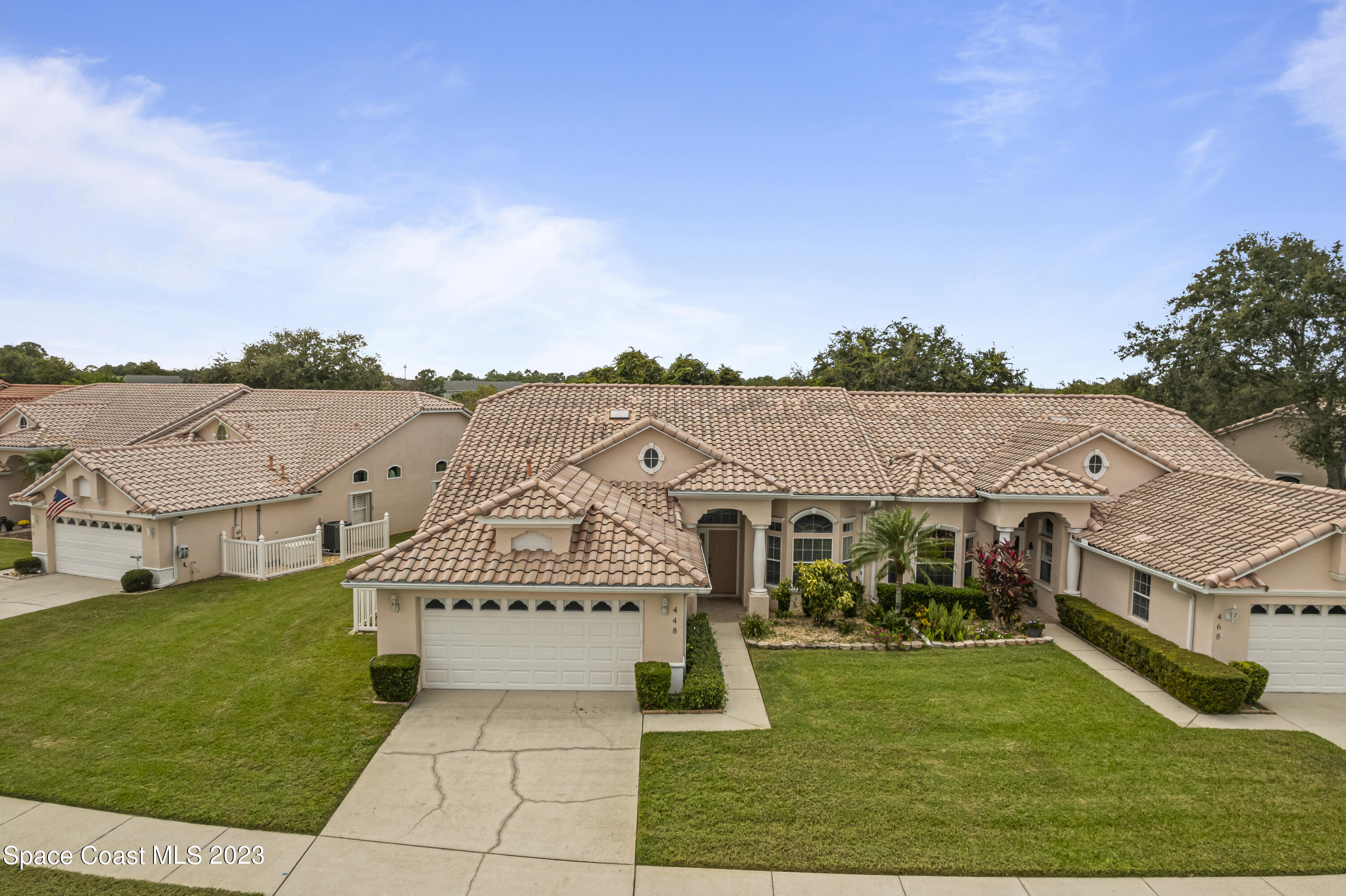 448 Renaissance Avenue Melbourne, FL 32940 - Photo 57 of 57 an aerial view of residential houses with outdoor space and trees