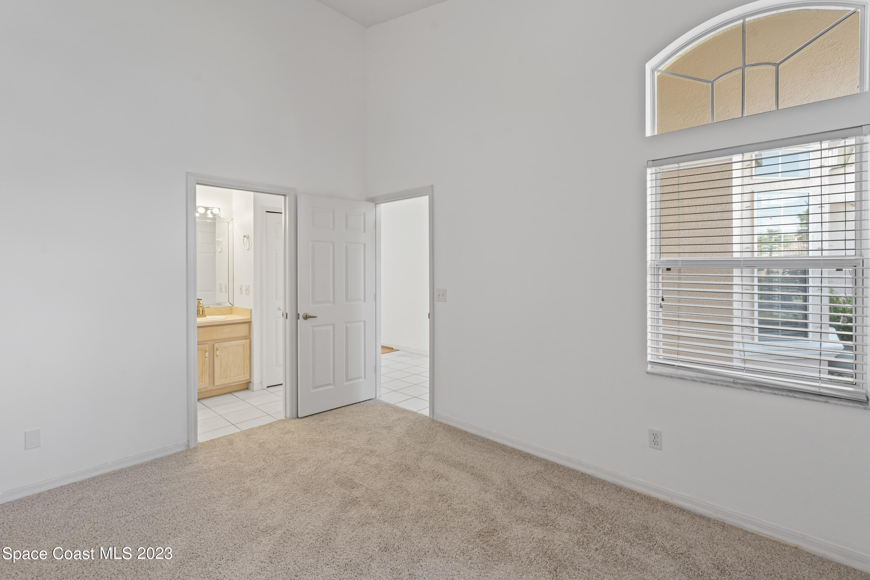 448 Renaissance Avenue Melbourne, FL 32940 - Photo 7 of 57 a view of an empty room with a window