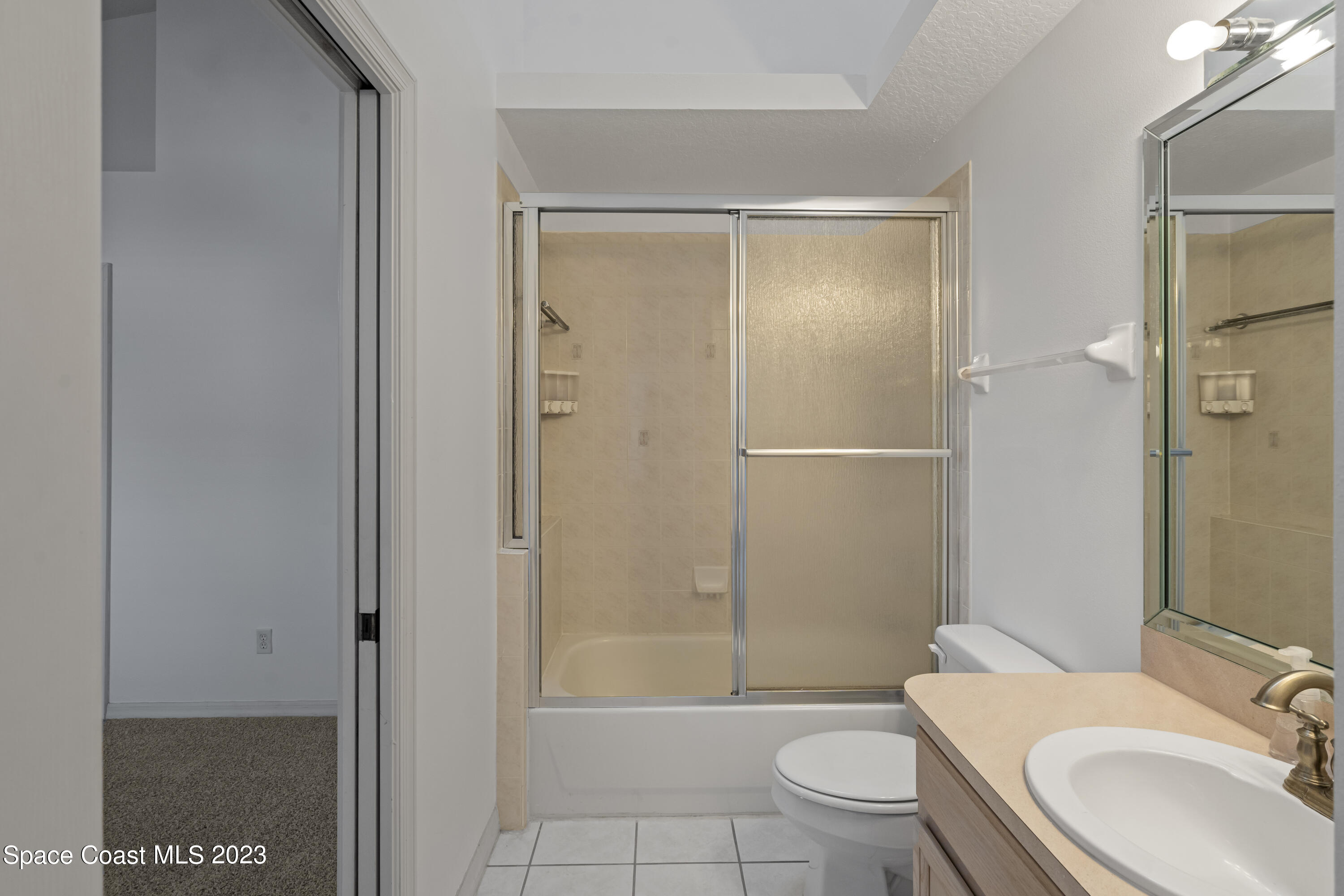 448 Renaissance Avenue Melbourne, FL 32940 - Photo 9 of 57 a bathroom with a granite countertop sink toilet and shower