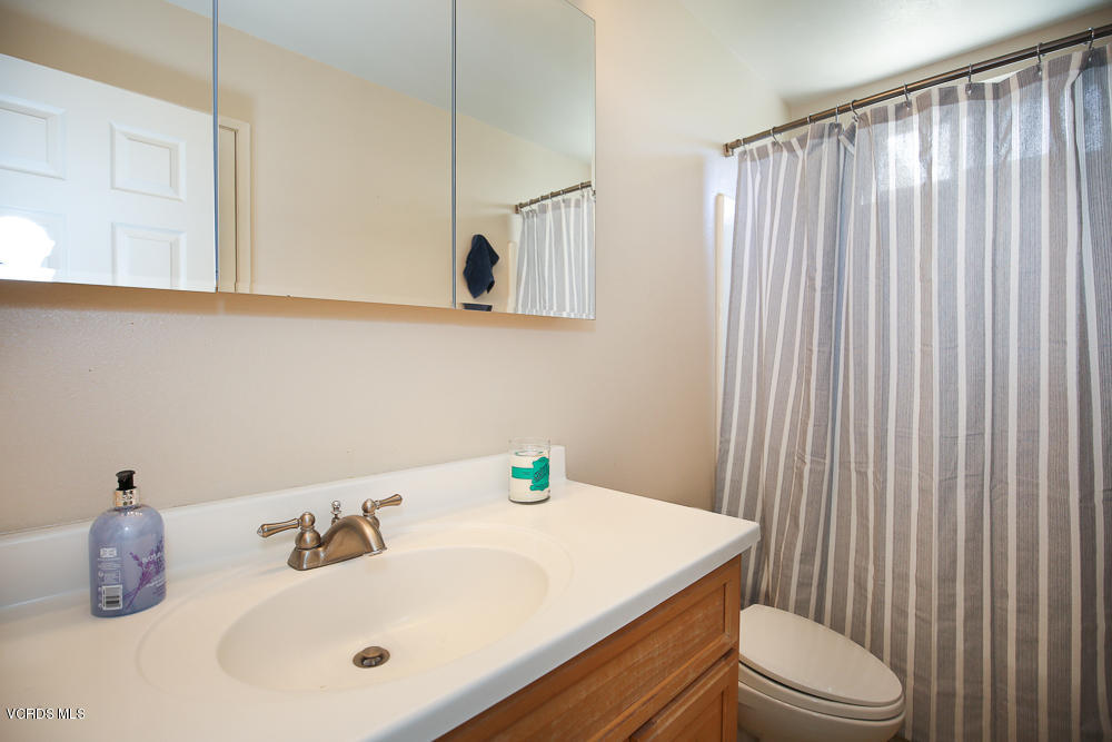 254 Maple Road Newbury Park, CA 91320 - Photo 18 of 24 a bathroom with a sink a toilet and mirror