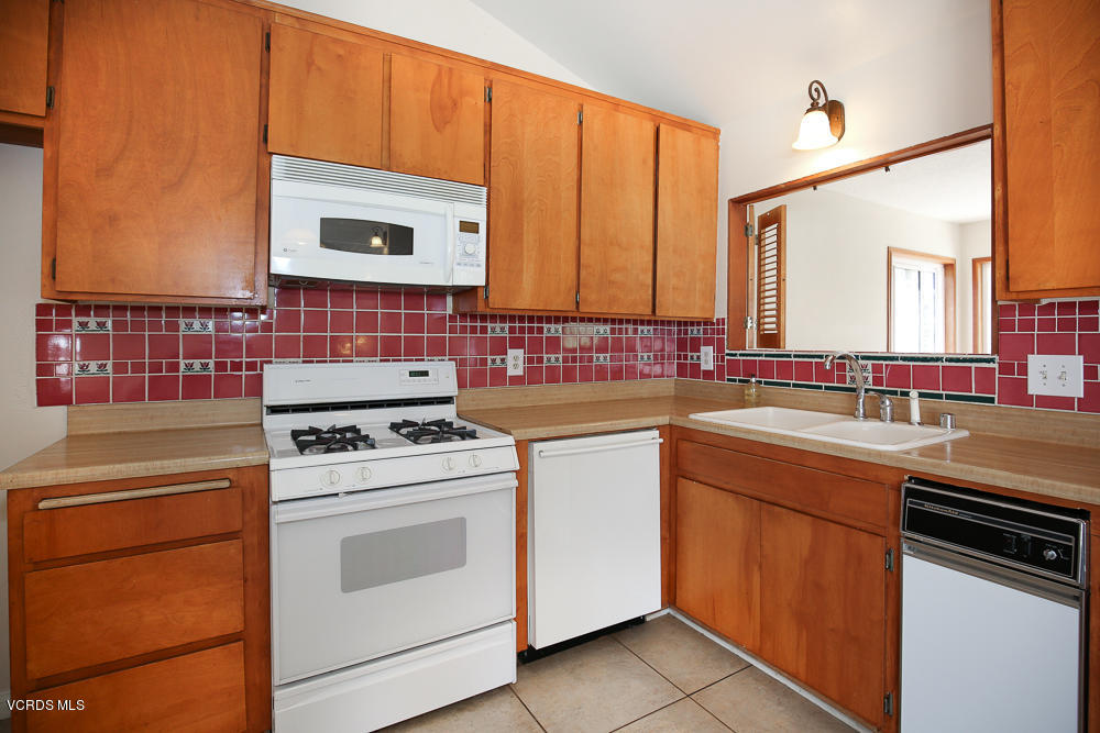 254 Maple Road Newbury Park, CA 91320 - Photo 10 of 24 a kitchen with a stove sink and cabinets
