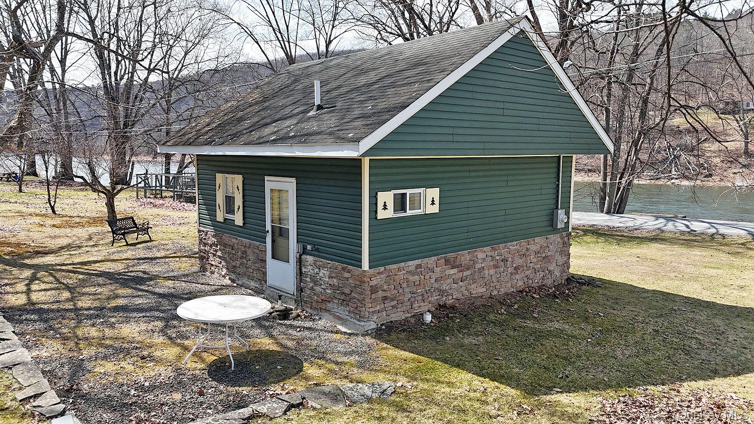 860 River Road Callicoon, NY 12723 - Photo 18 of 27 Back side of cottage with patio.