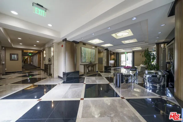 a large hall with lots of tables and chairs