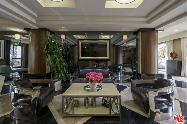 a living room with furniture and flat screen tv