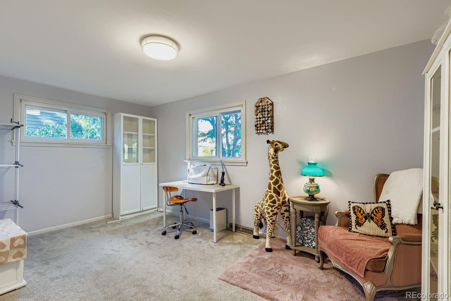 7049 Reed Court Arvada, CO 80003 - Photo 15 of 28 a living room with furniture and a window