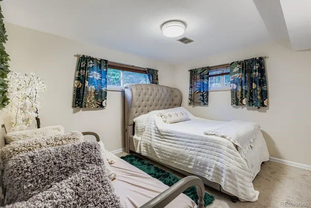 a bedroom with a bed and dresser