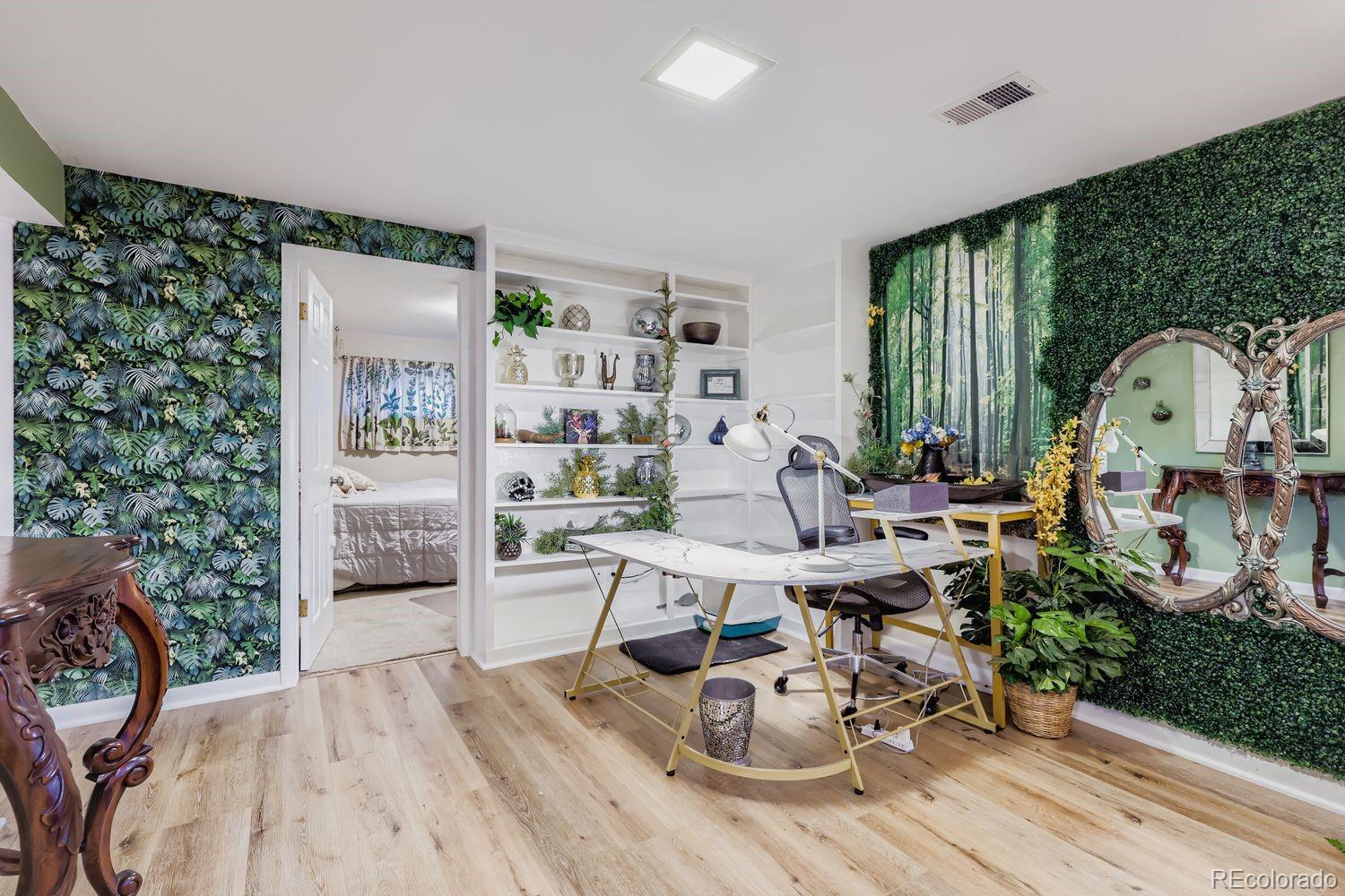 7049 Reed Court Arvada, CO 80003 - Photo 19 of 28 a living room with furniture a rug and a large window