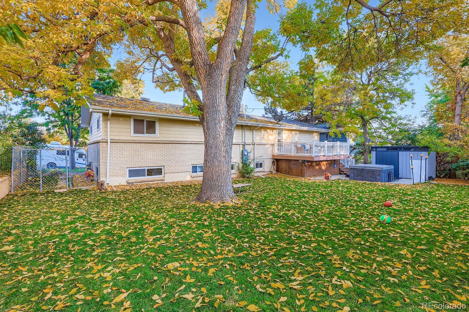 7049 Reed Court Arvada, CO 80003 - Photo 27 of 28 a house view with a garden space