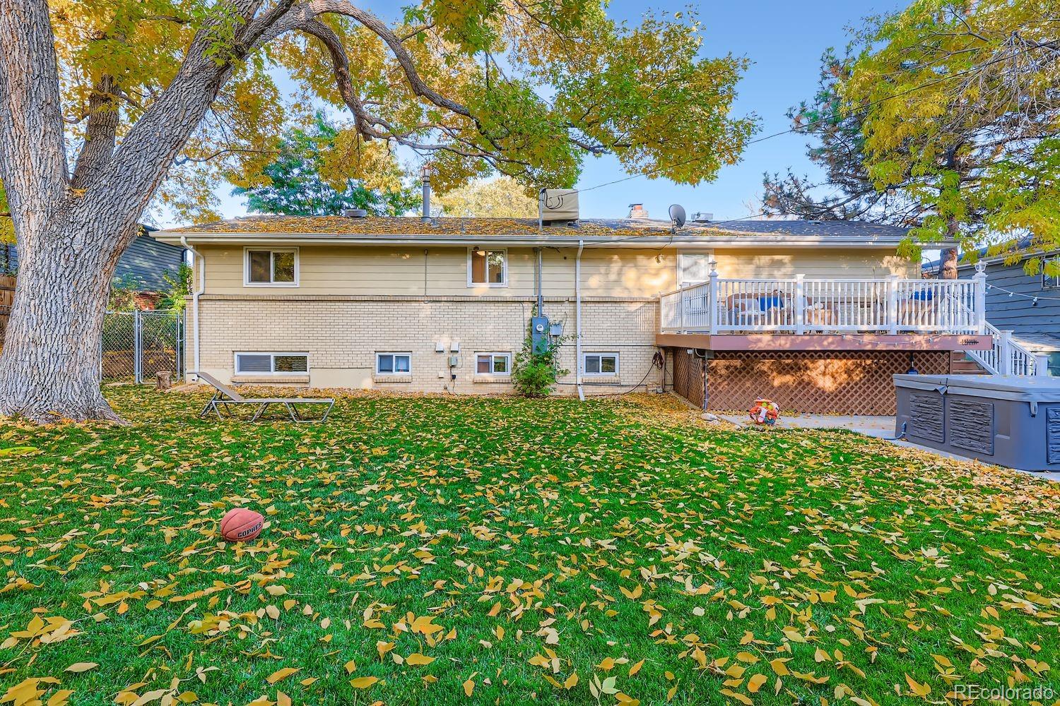 7049 Reed Court Arvada, CO 80003 - Photo 28 of 28 a front view of a house with garden