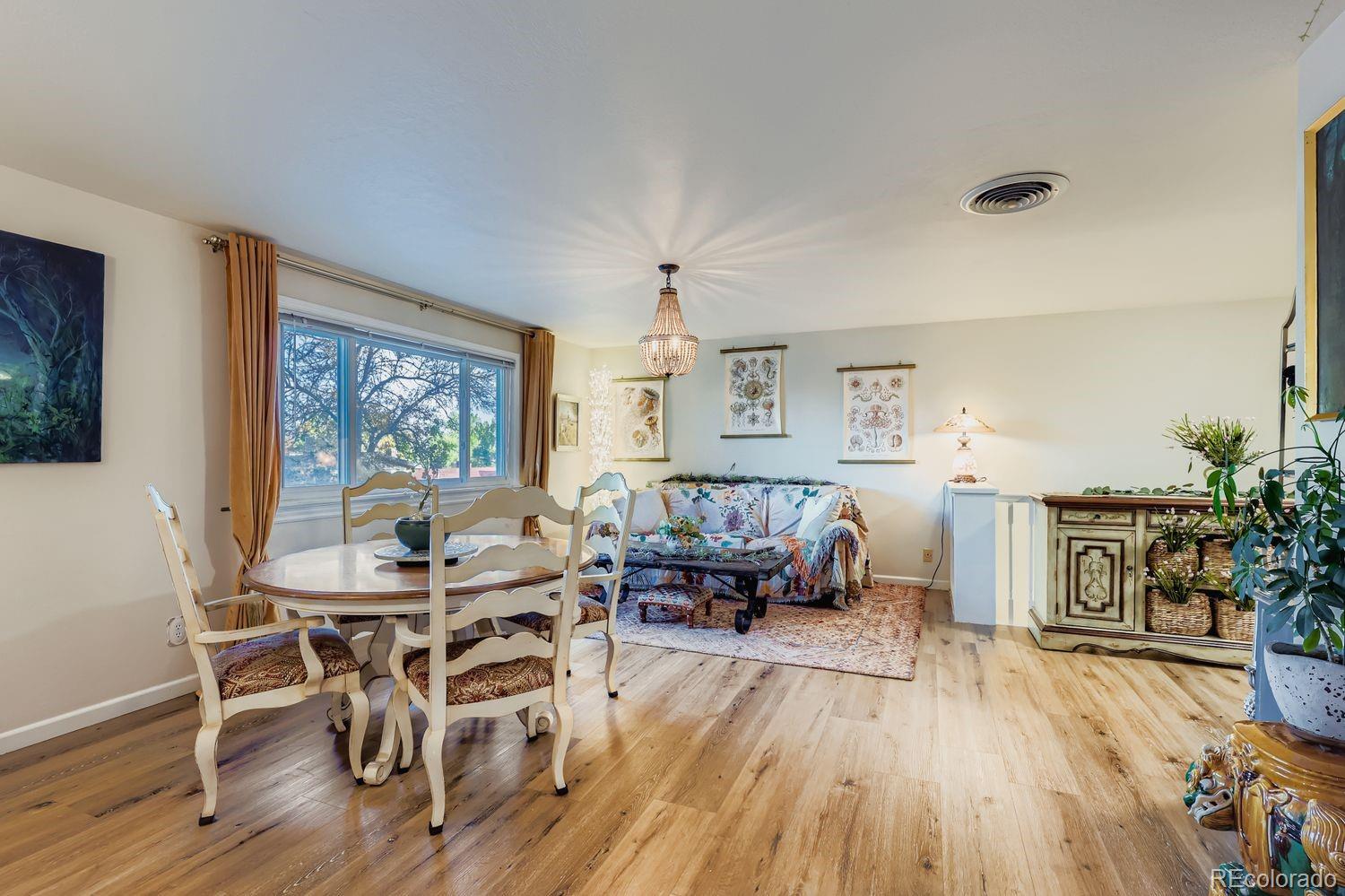 7049 Reed Court Arvada, CO 80003 - Photo 5 of 28 a living room with furniture and a wooden floor