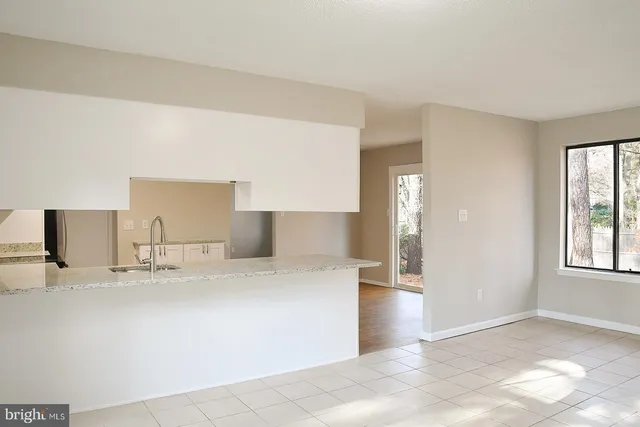 a view of a hallway with washer and dryer