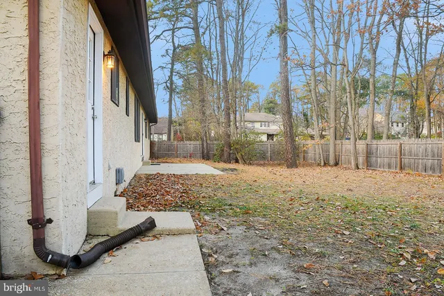 a big house with large trees and a big yard