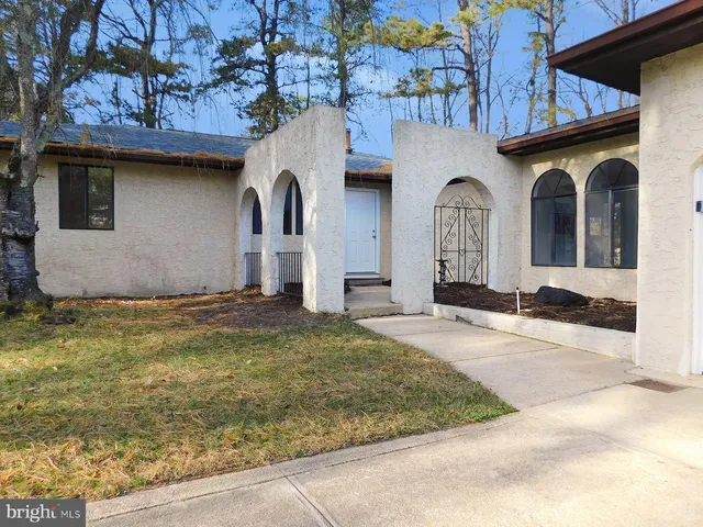 a house with garden in front of it