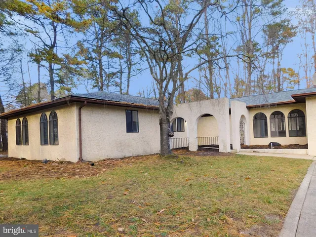 a house with trees in front of it