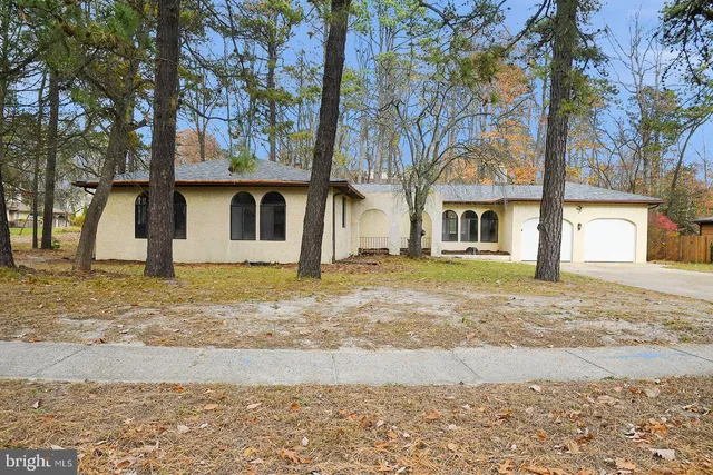 a large kitchen with cabinets stainless steel appliances and a counter space