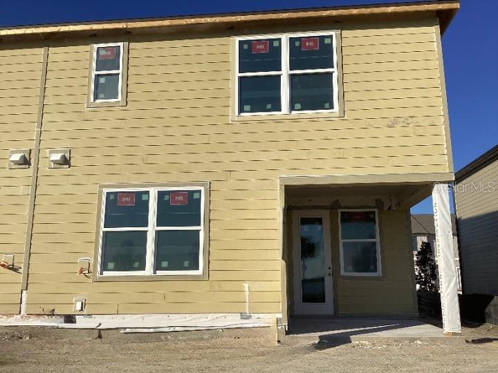 1219 Bluewater Lane Rockledge, FL 32955 - Photo 28 of 29 a front view of a house with a yard and garage