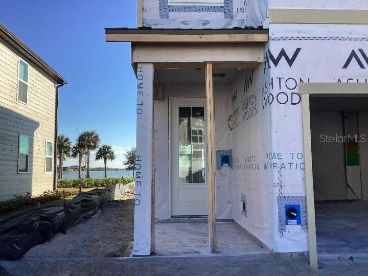 1219 Bluewater Lane Rockledge, FL 32955 - Photo 4 of 29 a view of a hallway with wooden floor and a living room
