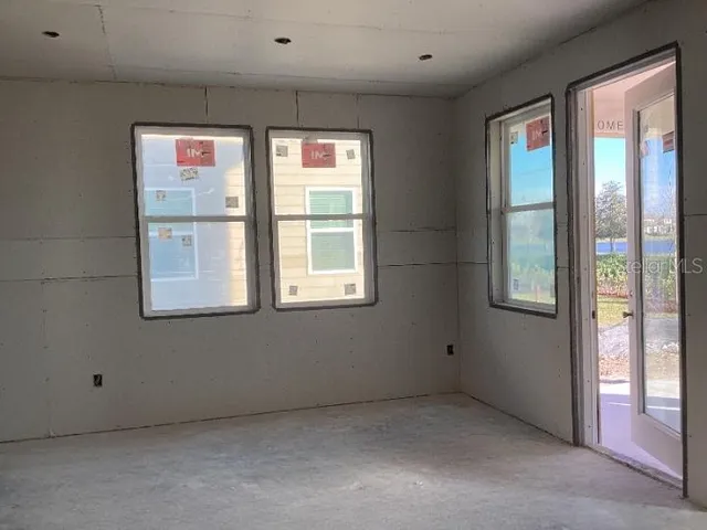 a view of an empty room with a window