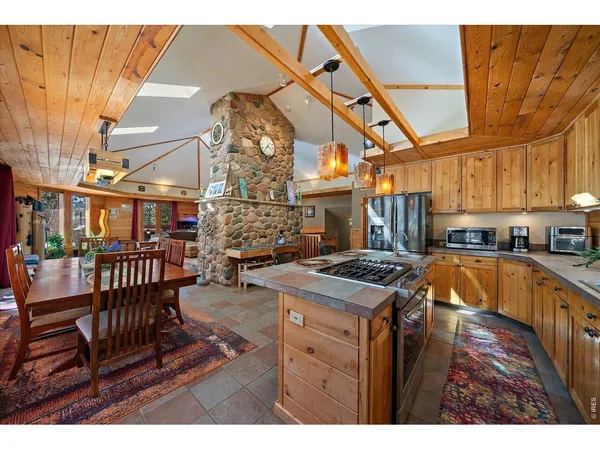 a kitchen with stainless steel appliances granite countertop a stove and a cabinets