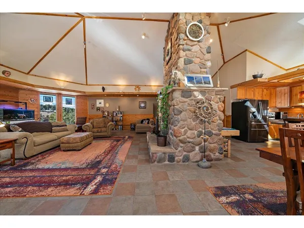 a living room with lots of furniture a chandelier