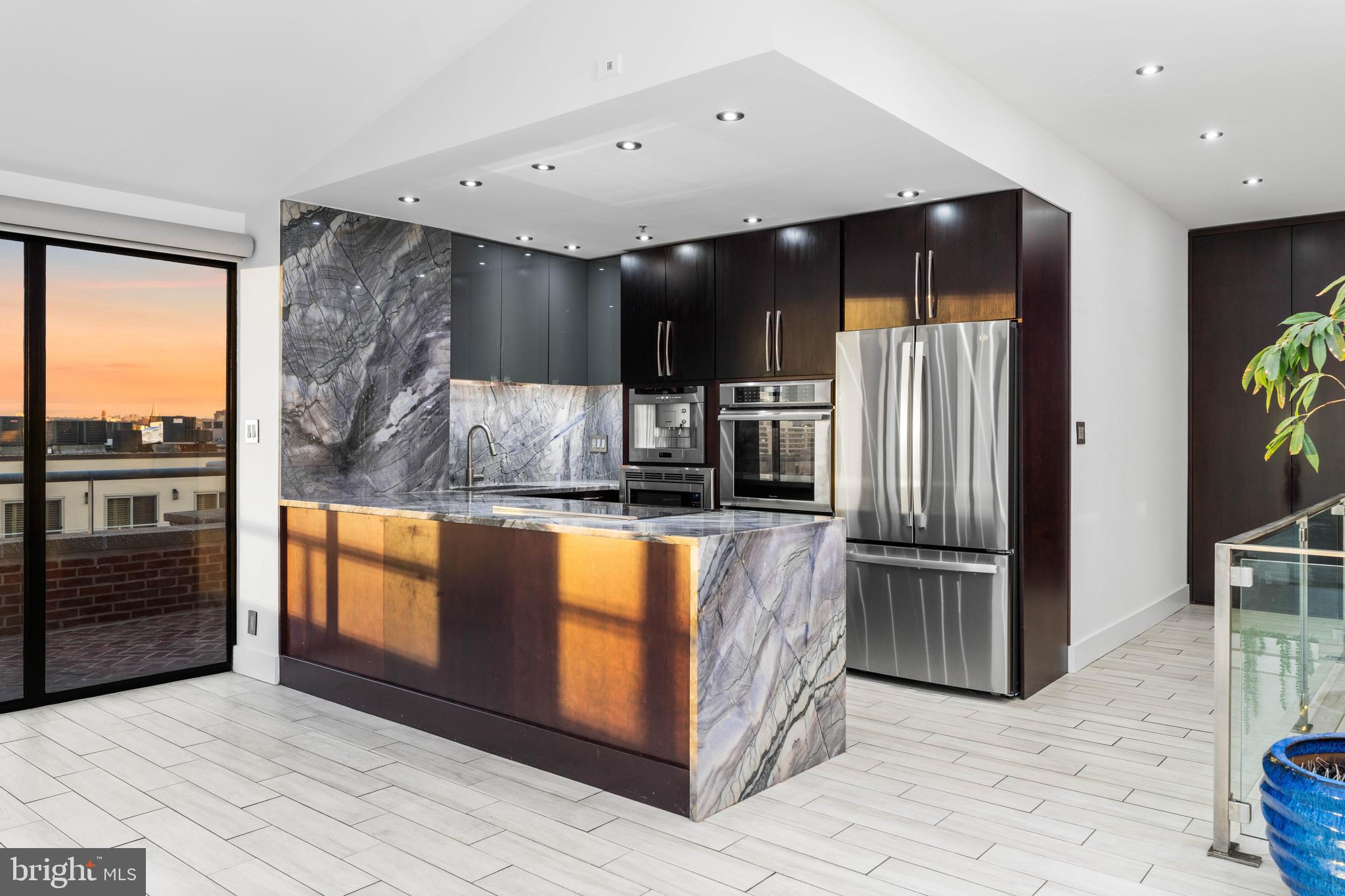 1000 Fell Street, Unit 646 Baltimore, MD 21231 - Photo 10 of 47 a kitchen with stainless steel appliances granite countertop a refrigerator and a sink