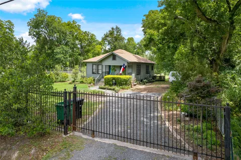 a view of a wrought iron fences in front of house