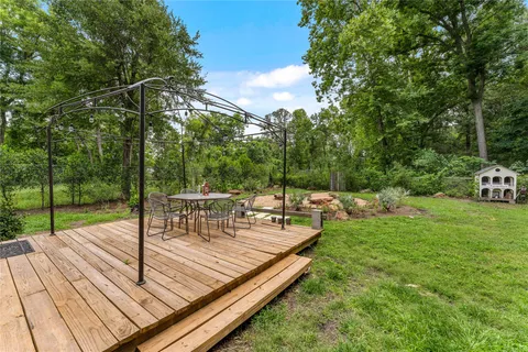a view of a chairs and table on the wooden floor
