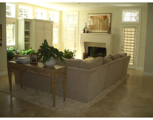 11 Princeton Road Brookline, MA 02467 - Photo 5 of 13 a living room with furniture a large window and a fireplace