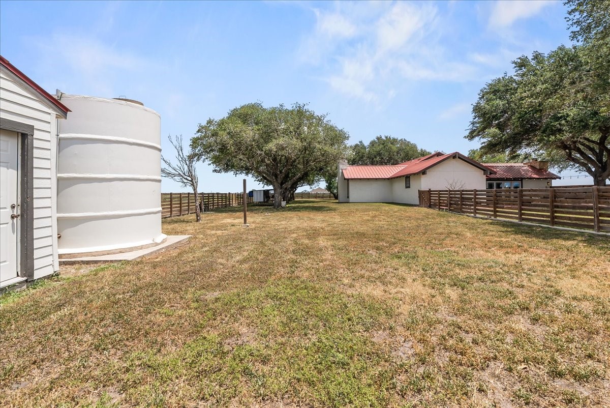 9795 County Road 2249 Sinton, TX 78387 - Photo 30 of 37 front view of a house with a yard