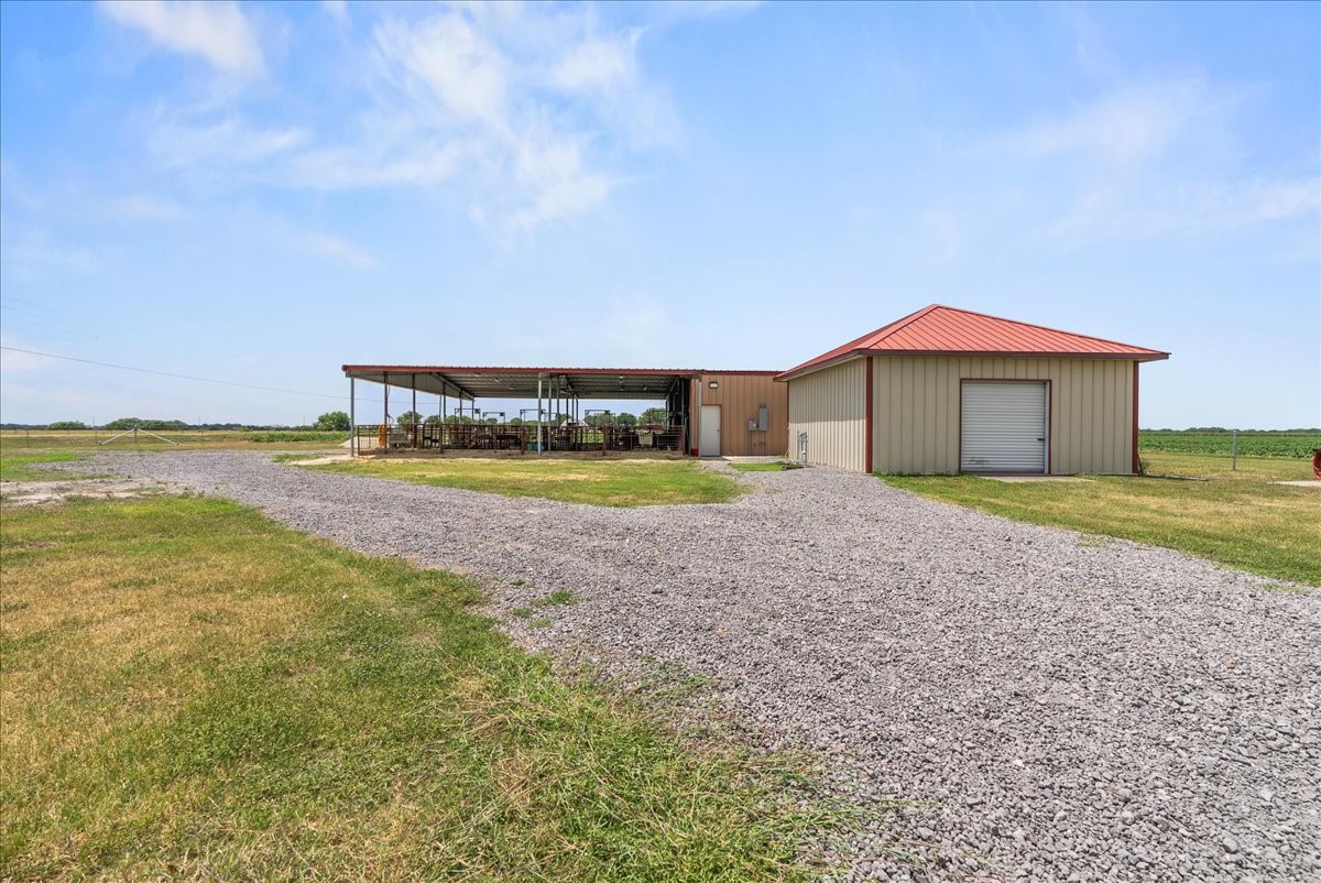 9795 County Road 2249 Sinton, TX 78387 - Photo 31 of 37 a view of a house with a yard and lake view