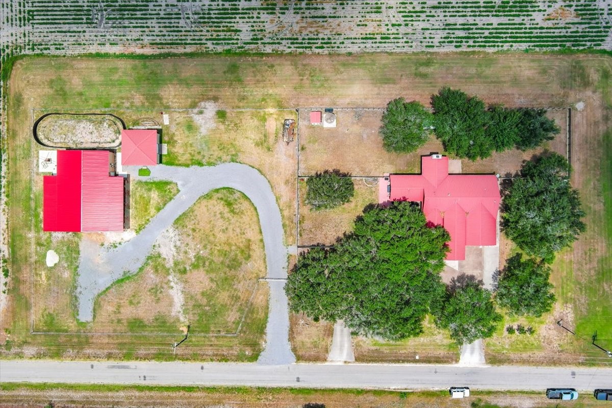 9795 County Road 2249 Sinton, TX 78387 - Photo 37 of 37 an aerial view of a house with a lake view