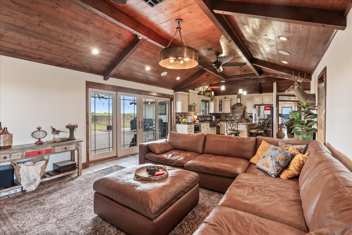9795 County Road 2249 Sinton, TX 78387 - Photo 5 of 37 a living room with furniture a ceiling fan and a window