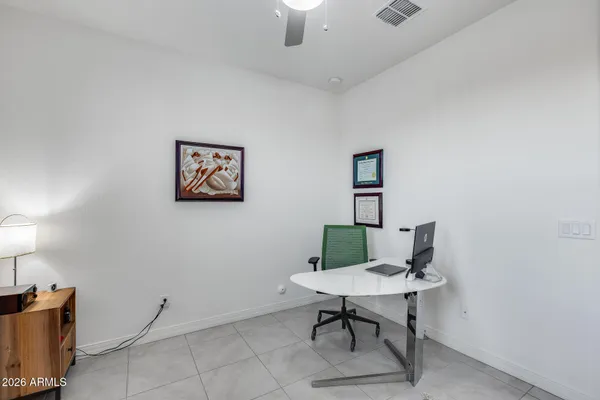 a view of a workspace with furniture