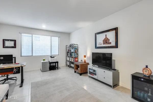 a room with furniture and a flat screen tv