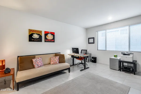 a living room with furniture and a window
