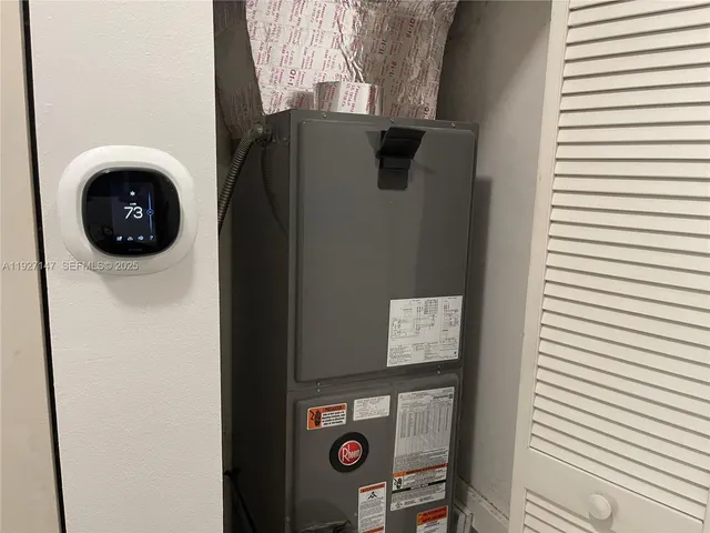 a view of front door and potted plants