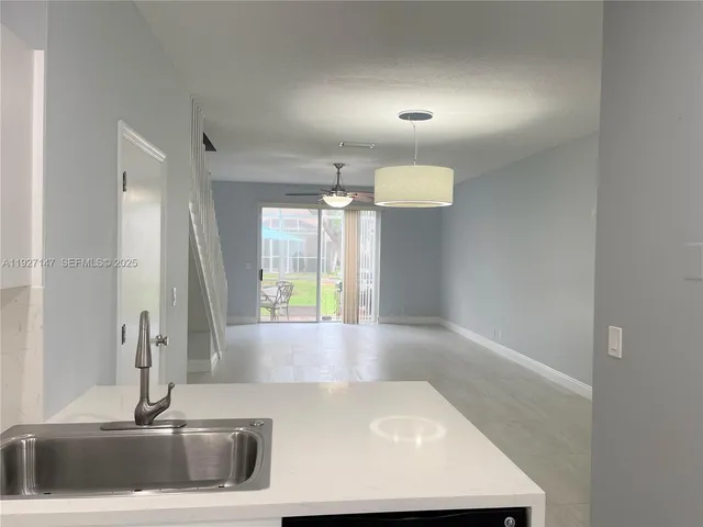 a view of a bathroom sink and a bathtub