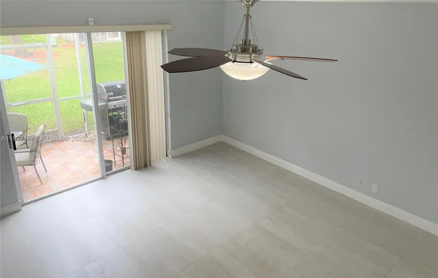 an empty room with windows and outdoor view