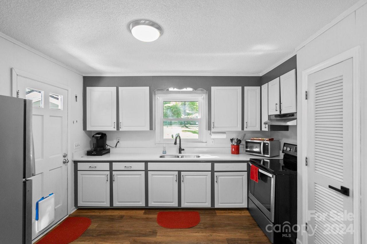 1405 Deer Run Road Ridgeway, SC 29130 - Photo 11 of 48 a kitchen with stainless steel appliances granite countertop a sink stove and refrigerator