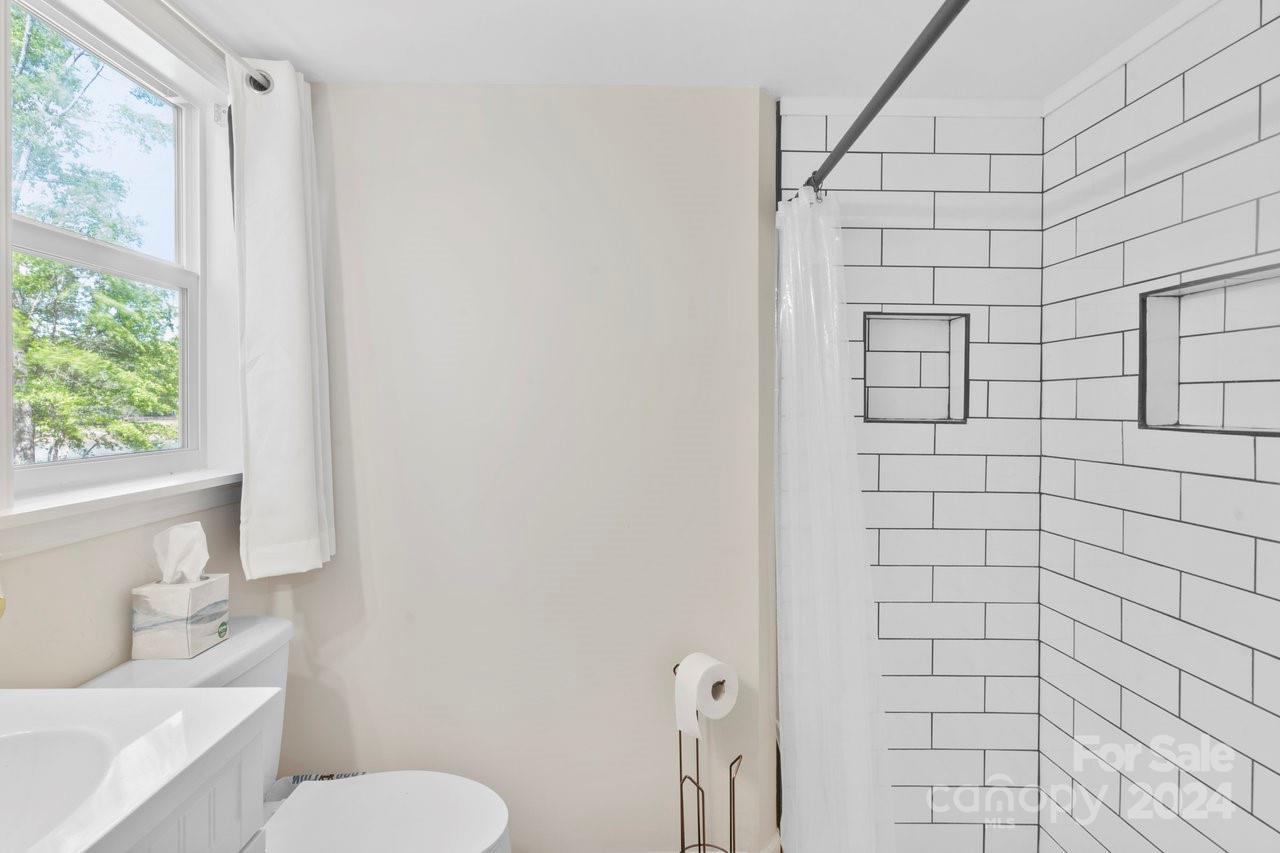 1405 Deer Run Road Ridgeway, SC 29130 - Photo 15 of 48 a white toilet sitting next to a bathroom sink