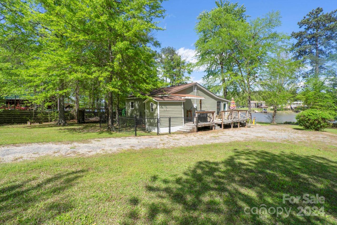 1405 Deer Run Road Ridgeway, SC 29130 - Photo 23 of 48 a house view with swimming pool and sitting area